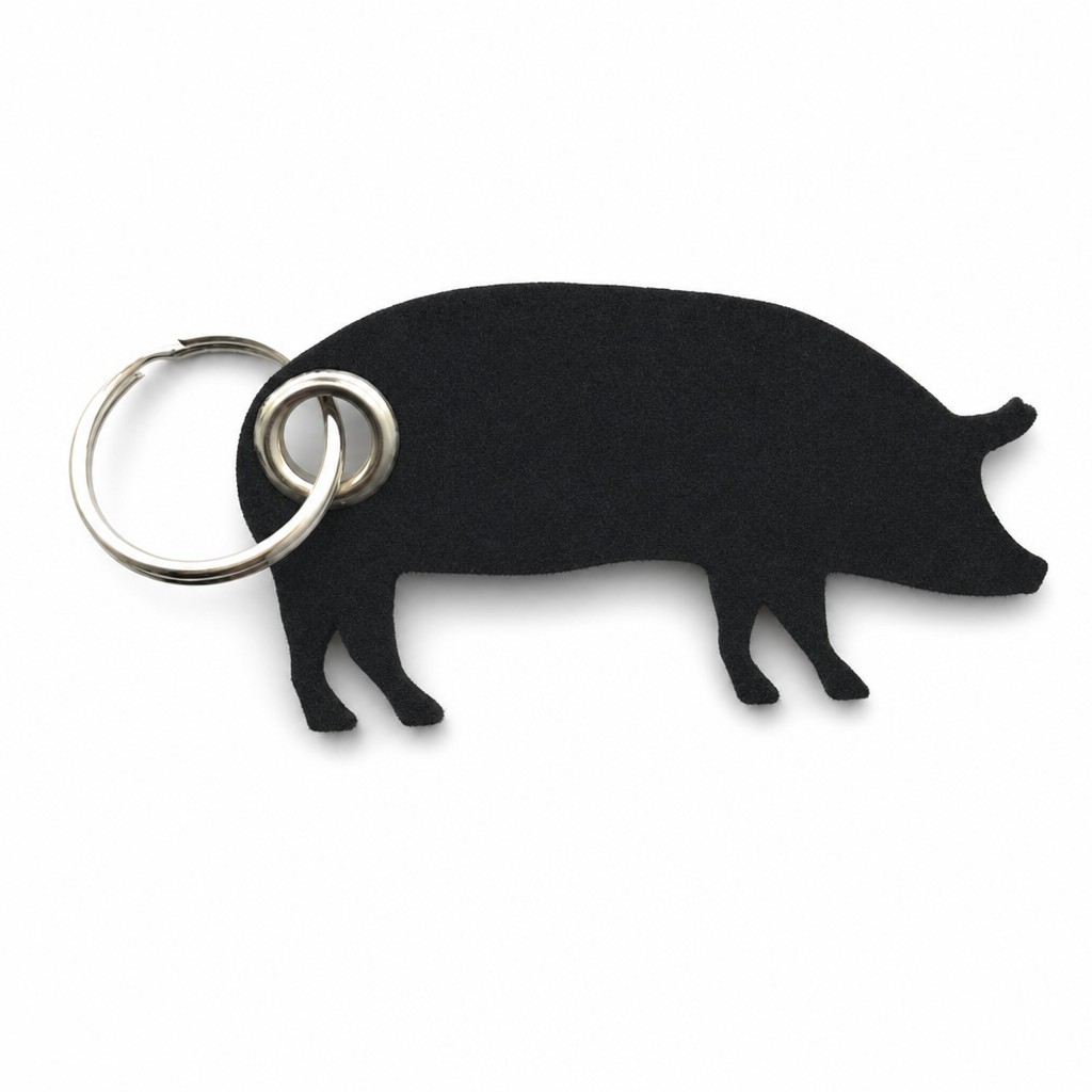 Filz-Schlüsselanhänger Schwein in Schwarz mit Metallöse und Schlüsselring – Werbeartikel aus 3 mm Filz (mit KI bearbeitetes Bild)