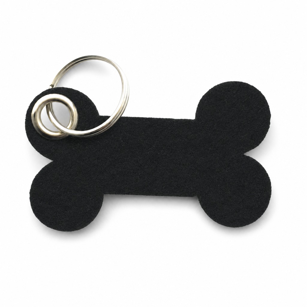 Filz-Schlüsselanhänger Knochen in Schwarz mit Metallöse und Schlüsselring – Werbeartikel aus 3 mm Filz (mit KI bearbeitetes Bild)